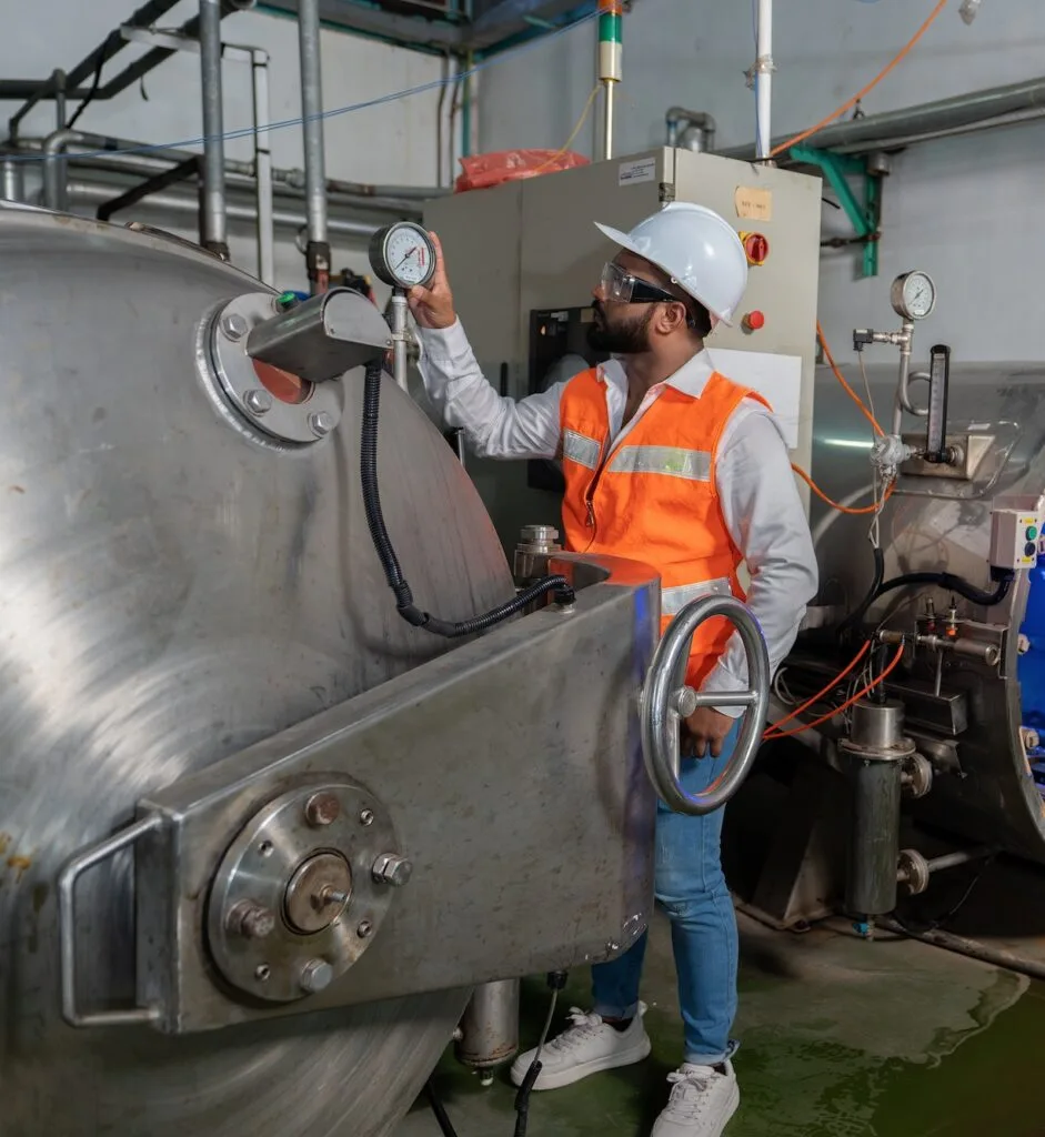 Engineer perform boiler spray nozzle leakage check at pressure tank during plant outage shutdown